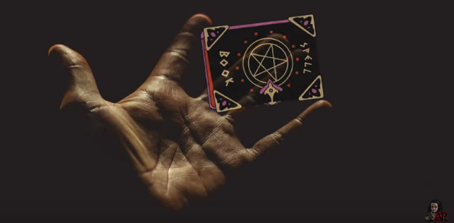 Hand holding spellbook - screenshot